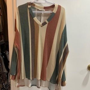 Never worn Jodifl brand long sleeve shirt. Size SMALL fits 0-8 size.